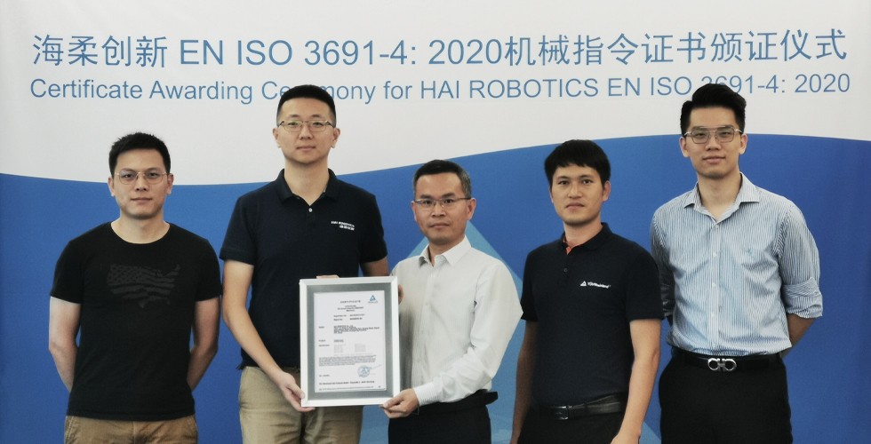Fang Bing, Co-founder and COO of HAI ROBOTICS (second left) Receiving the CE Certificate.jpg.jpg